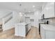 Modern kitchen with white cabinets, island, and stainless steel appliances at 5755 Cr W 750 N, McCordsville, IN 46055