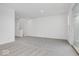 Spacious living room with grey carpet and access to upper level at 5755 Cr W 750 N, McCordsville, IN 46055