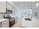 Modern kitchen with gray cabinets and stainless steel appliances at 5763 Cr W 750 N, McCordsville, IN 46055