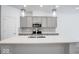 Modern kitchen with gray cabinets, white countertops, and island at 5763 Cr W 750 N, McCordsville, IN 46055