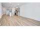 Open living room and kitchen with light wood flooring at 5763 Cr W 750 N, McCordsville, IN 46055