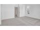Simple bedroom with grey carpet and access to a hallway at 5767 Cr W 750 N, McCordsville, IN 46055