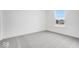 Simple bedroom with grey carpet and a large window overlooking the neighborhood at 5767 Cr W 750 N, McCordsville, IN 46055