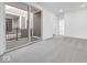Bedroom featuring a private balcony, grey carpet, and neutral walls at 5767 Cr W 750 N, McCordsville, IN 46055
