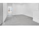 Bright hallway with grey carpet and access to other rooms at 5767 Cr W 750 N, McCordsville, IN 46055