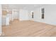 Open living room with hardwood floors and large windows at 5767 Cr W 750 N, McCordsville, IN 46055