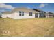 The backyard is a blank canvas with a newly built home and a large grass yard, full of potential at 6033 Granby Dr, Whitestown, IN 46075