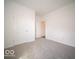 Bright bedroom features neutral carpet, white walls, and two doors for easy access at 6033 Granby Dr, Whitestown, IN 46075
