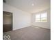 Bright and airy bedroom with a large window offering natural light and carpeted floors at 6033 Granby Dr, Whitestown, IN 46075