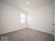 Clean bedroom with carpeted floor, window for natural light, and freshly painted white walls at 6033 Granby Dr, Whitestown, IN 46075