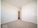 Cozy bedroom with neutral carpet, ample wall space, and a closet, perfect for personalization at 6033 Granby Dr, Whitestown, IN 46075