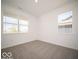 Empty bedroom featuring neutral carpet, large windows for natural light, and freshly painted white walls at 6033 Granby Dr, Whitestown, IN 46075