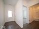 Bright entryway with a tiled floor, white walls, and an adjacent door to a bathroom and spare room at 6033 Granby Dr, Whitestown, IN 46075