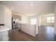 Modern kitchen with stainless steel appliances, gray cabinets, and a stylish island at 6033 Granby Dr, Whitestown, IN 46075
