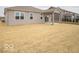 Spacious backyard with covered patio and view of the home's exterior at 6047 Granby Dr, Whitestown, IN 46075