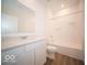 Well-lit bathroom with a white vanity, a tub, and a shower combination at 6047 Granby Dr, Whitestown, IN 46075