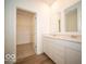 Bathroom featuring double vanity, tile floor, and walk-in closet at 6047 Granby Dr, Whitestown, IN 46075