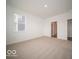 Bedroom with carpet flooring and access to an ensuite bathroom at 6047 Granby Dr, Whitestown, IN 46075