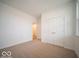 Clean and bright bedroom featuring neutral carpet and a double door closet at 6047 Granby Dr, Whitestown, IN 46075