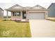 Charming single-story brick home with a covered porch and well-maintained front yard at 6047 Granby Dr, Whitestown, IN 46075