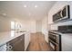 Bright kitchen with stainless steel appliances and modern recessed lighting at 6047 Granby Dr, Whitestown, IN 46075