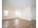 Bright living room with recessed lighting and wood-look flooring at 6047 Granby Dr, Whitestown, IN 46075