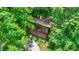 Unique aerial view showing a home with a pergola porch, shingle siding, and mature trees for ultimate privacy at 6377 N Tutterow Rd, Monrovia, IN 46157