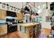 Spacious kitchen with a center island, stainless steel appliances, and hanging pot rack at 6377 N Tutterow Rd, Monrovia, IN 46157
