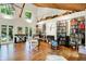 Bright living room with a wood ceiling, built-in bookshelves, and French doors leading to the outdoors at 6377 N Tutterow Rd, Monrovia, IN 46157