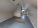 Unfinished attic bedroom with sloped ceilings and hardwood floors at 837 S Warman S Ave, Indianapolis, IN 46221
