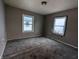 Bedroom with gray walls and gray carpeting at 837 S Warman S Ave, Indianapolis, IN 46221