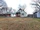 Two-story house with wood siding, steps leading to the front door, and a small yard at 837 S Warman S Ave, Indianapolis, IN 46221