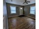 Living room featuring hardwood floors and a ceiling fan at 837 S Warman S Ave, Indianapolis, IN 46221