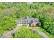 Aerial view of sprawling home on private lot surrounded by mature trees at 8602 Frontgate Ln, Indianapolis, IN 46256