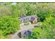 Expansive view of the home and outbuilding from above, nestled in a wooded area at 8602 Frontgate Ln, Indianapolis, IN 46256