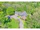 Sprawling home sits within a lush landscape, captured from a birds-eye perspective at 8602 Frontgate Ln, Indianapolis, IN 46256