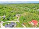 A sprawling estate home with mature trees, landscaping, and a private drive at 8602 Frontgate Ln, Indianapolis, IN 46256