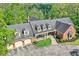 Stunning aerial of the elegant home, set among lush greenery and mature trees at 8602 Frontgate Ln, Indianapolis, IN 46256