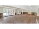 Large basement featuring a brick floor, white walls, and sliding glass doors at 8602 Frontgate Ln, Indianapolis, IN 46256