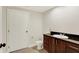 Well lit bathroom with granite counters and wood cabinetry at 8602 Frontgate Ln, Indianapolis, IN 46256