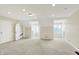 Spacious bedroom with bright lighting and doorways to closets and hallway at 8602 Frontgate Ln, Indianapolis, IN 46256