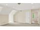 A spacious room featuring plush carpeting, complemented by recessed lighting, and abundant natural light at 8602 Frontgate Ln, Indianapolis, IN 46256