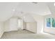 Spacious bedroom with neutral carpet, recessed lighting, and ample natural light from the window at 8602 Frontgate Ln, Indianapolis, IN 46256