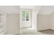 Small bedroom with plush carpeting, a closet, and natural light from a window at 8602 Frontgate Ln, Indianapolis, IN 46256