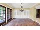 Formal dining room boasts hardwood floors, a built-in hutch, and French doors to the patio at 8602 Frontgate Ln, Indianapolis, IN 46256