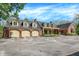 Stunning two-story brick home with large three-car garage and expansive driveway at 8602 Frontgate Ln, Indianapolis, IN 46256