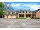 Stunning two-story brick home with large three-car garage and expansive driveway at 8602 Frontgate Ln, Indianapolis, IN 46256