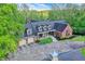 Aerial view showcasing the home's design, driveway, and landscaping at 8602 Frontgate Ln, Indianapolis, IN 46256