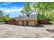 View of a detached brick garage with multiple bays, offering ample parking or storage at 8602 Frontgate Ln, Indianapolis, IN 46256