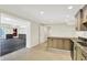 Second kitchen area features light cabinets, granite counters, and tile floor at 8602 Frontgate Ln, Indianapolis, IN 46256